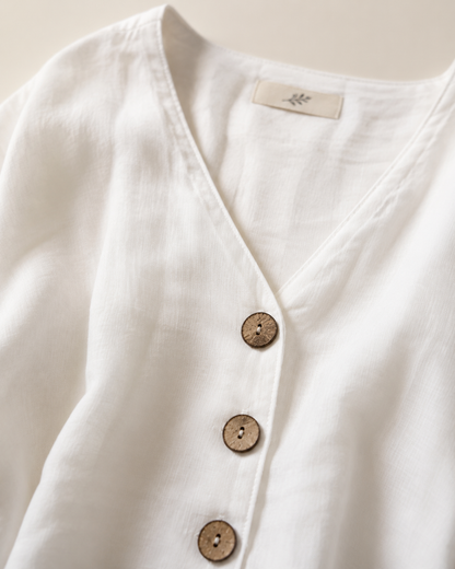 Vivia Linen Blouse — White V-neckline and wooden button detail