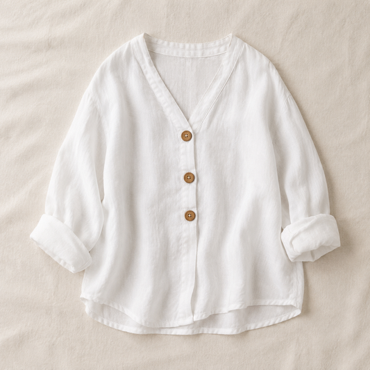 Vivia Linen Blouse — White flat lay on cream linen surface
