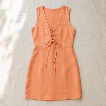 Vivia Linen Tie Dress — Apricot flat lay on cream linen