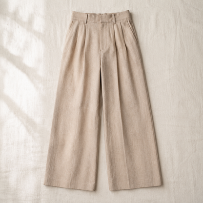 Vivia All-Day Trouser — flat lay in Stone Beige on cream linen